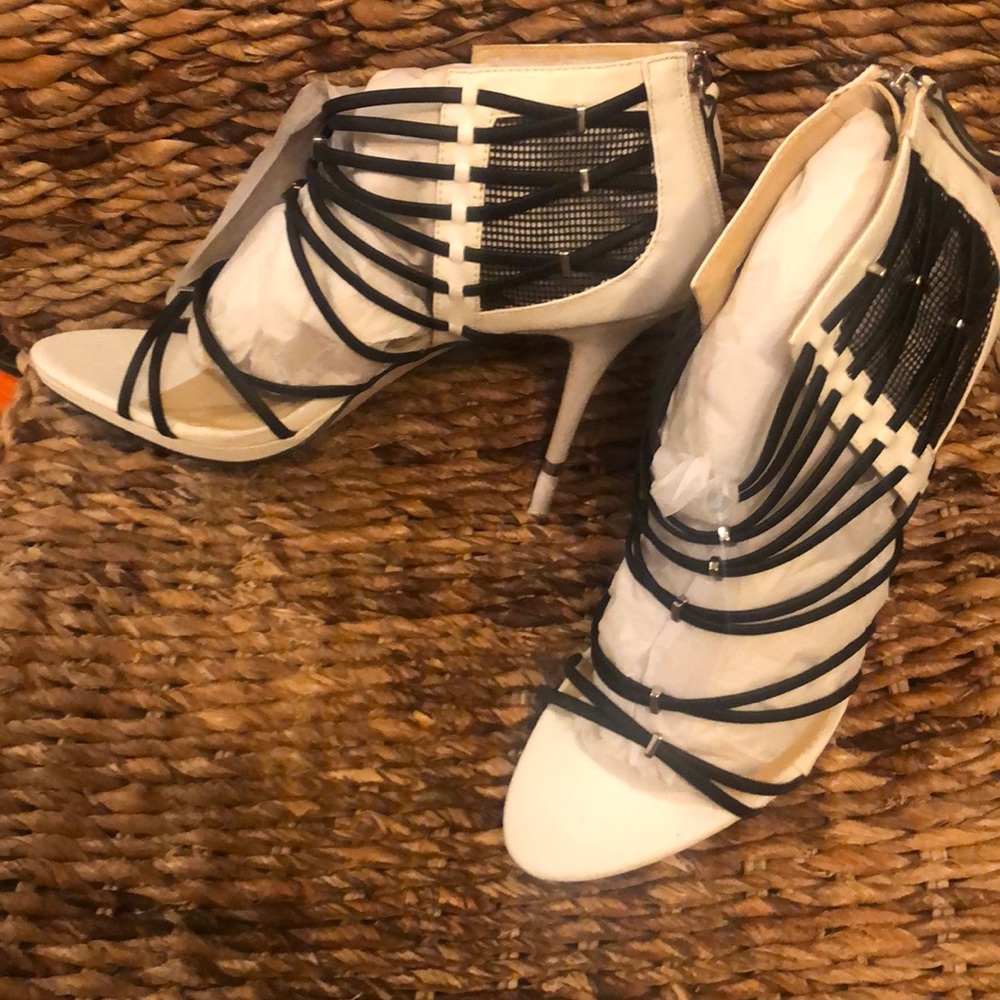 White high heel shoes with black accents